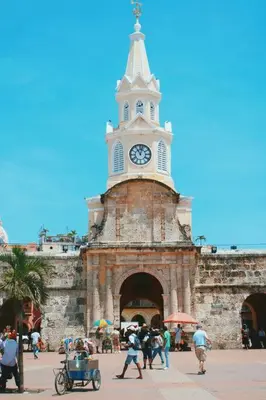a building with a clock tower on top of it at Apartamento Edificio los Delfines Bocagrande , ubicación y precio in Cartagena de Indias