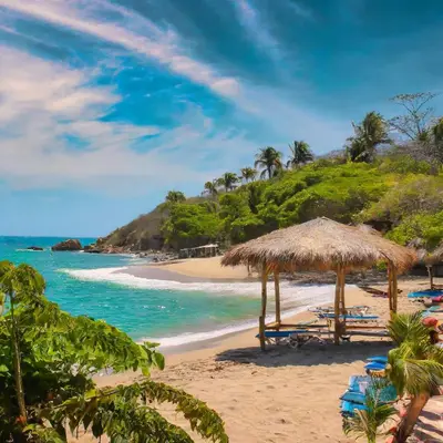 a beach with chairs and umbrellas and the ocean at Punta Arena EcoHostal & EcoFit - Your Eco-Friendly Oasis in Playa Punta Arena