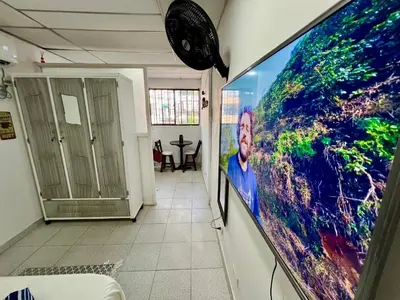 a large flat screen tv hanging on a wall at Belcanto Room's in Cartagena de Indias