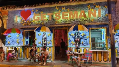 a group of people sitting outside of a restaurant at Acogedor Apto en piso 22 vista al mar in Cartagena de Indias