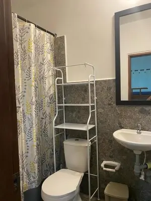 a bathroom with a toilet and a sink at Cabañas Paulamar - Apto 4 - Tolú in Santiago