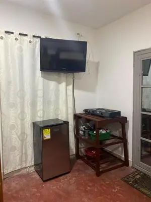 a living room with a flat screen tv on the wall at Cabañas Paulamar - Apto 4 - Tolú in Santiago