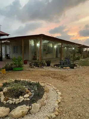 a house with a garden in front of it at Cabañas Paulamar - Apto 4 - Tolú in Santiago