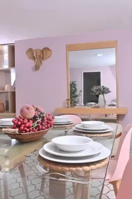 a table with plates and bowls of fruit on it at Apartahotel Edificio Baquero x10 Apto 403 in Barranquilla