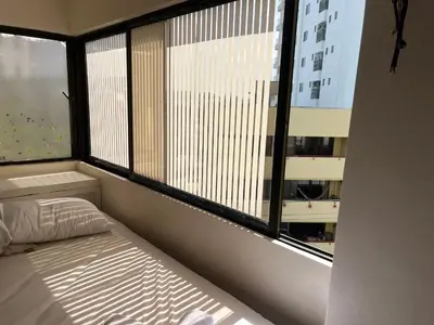 a bedroom with a bed and a large window at Cabrero, cerca de la Ciudad Amurallada y playa in Cartagena de Indias