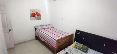 a small bedroom with a small bed in a room at Apartamento Amoblado Confortable in Cartagena de Indias