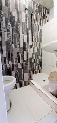 a bathroom with a sink and a toilet and a shower at Apartamento Amoblado Confortable in Cartagena de Indias