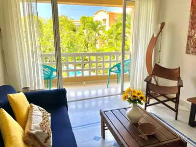 a living room with a couch and a table at by Calamari Homes - Parque Centenario 202 walled city in Cartagena de Indias