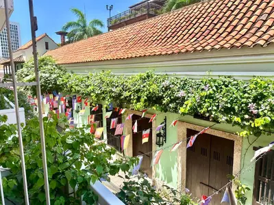 a house with clothes hanging on a clothes line at by Calamari Homes - Parque Centenario 202 walled city in Cartagena de Indias