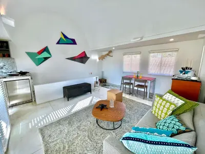 a living room with a couch and a table at by Calamari Homes - Parque Centenario casa 206 walled city in Cartagena de Indias
