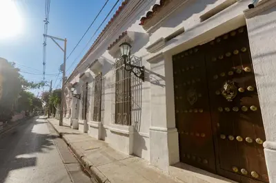 a building with two doors on the side of a street at Palmas de Alba Hotel Boutique in Cartagena de Indias