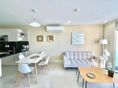 a living room with a couch and a table at by Calamari Homes - Infinitum 3302 Bocagrande in Cartagena de Indias