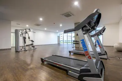 a gym with two treadmills and a treadmill at by Calamari Homes - Infinitum 3302 Bocagrande in Cartagena de Indias