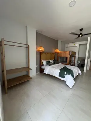 a bedroom with a bed and a ceiling fan at DELAMAR Casa de playa in Coveñas