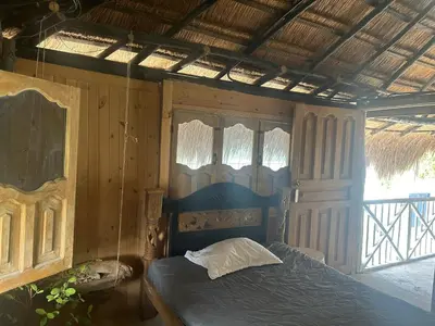a bedroom with a bed in a room at Punta Arena EcoHostal & EcoFit in Playa Punta Arena