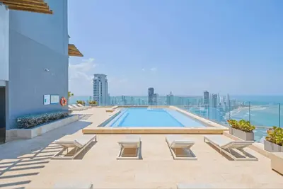 a swimming pool on top of a building at U-GO Edificio Murano Elite Bocagrande Frente al Mar in Cartagena de Indias