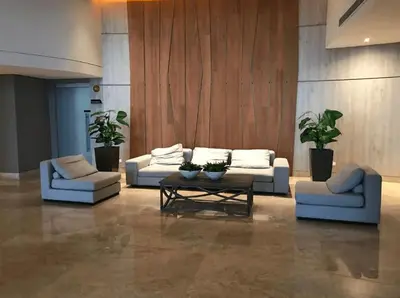 a living room with couches and a coffee table at U-GO Edificio Murano Elite Bocagrande Frente al Mar in Cartagena de Indias