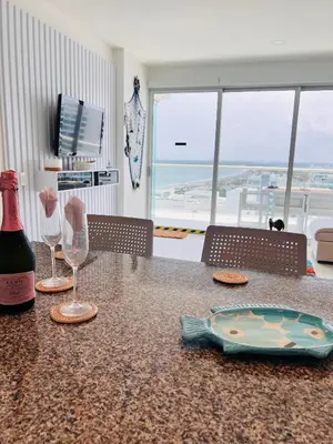 a table with a bottle of wine and a glass at Cartagena in Cartagena de Indias