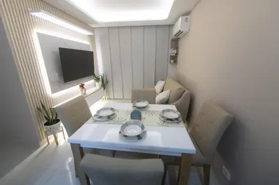 a small living room with a white table and chairs at Nice Apartment close to Historic City and beach in Cartagena de Indias