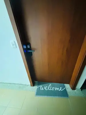 a welcome sign on the floor in front of a door at Nice Apartment close to Historic City and beach in Cartagena de Indias