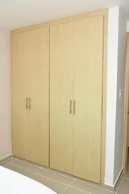 a pair of wooden cabinets in a room at Excelente ubicación y cómodo apto, perfecto para ti! in Barranquilla