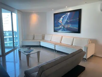 a living room with a couch and a table at Apartamento playa Morros, La boquilla, Cartagena de indias in Cartagena de Indias