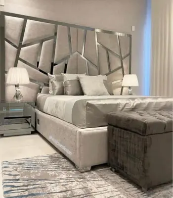 a bedroom with a large bed and a couch at Hotel Platinum Luxury in Barranquilla