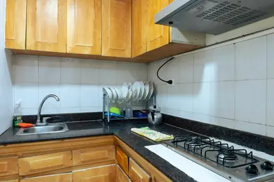 a kitchen with a sink and a stove top oven at Acogedor Apartaestudio Laguito 1 Habitacion N4A1 in Cartagena de Indias