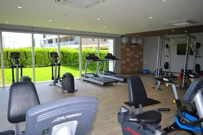a gym with several treadmills and exercise bikes at Lujoso Penthouse - Vista al Mar - Playa Privada in Cartagena de Indias