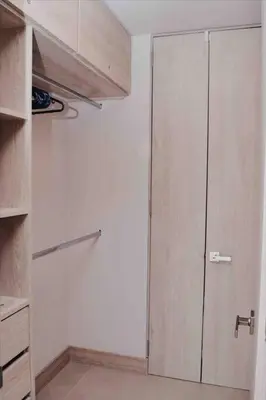 a kitchen with a closet with a door in it at Lujoso Penthouse - Vista al Mar - Playa Privada in Cartagena de Indias