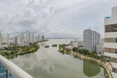 a river in the middle of a city with buildings at Un espacio sofisticado en medio de El Laguito Edificio Poseidon del Caribe in Cartagena de Indias