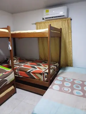 two bunk beds in a small room with at Cabaña Moñitos cerca al mar e Isla Fuerte in Moñitos