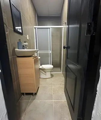 a bathroom with a toilet and a sink at Céntrico y confortable apto casa Doña yola 5 in Cartagena de Indias