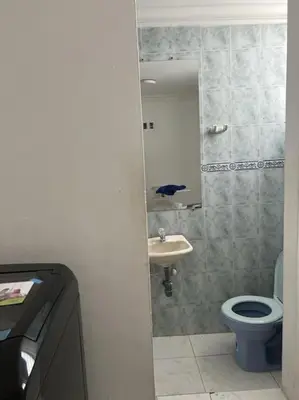 a bathroom with a toilet and a sink and a mirror at 360° Sea View Penthouse 17° floor, Cartagena in Cartagena de Indias