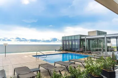 an image of a swimming pool on top of a building at U-GO Edificio H2 en Bocagrande Frente al Mar in Cartagena de Indias