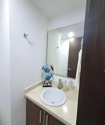 a bathroom with a white sink and a mirror at Apartamento 2 Dormitorios Morros. Vista Mar in Cartagena de Indias