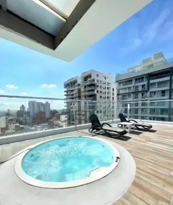 a hot tub on the roof of a building at Apartaestudio Jacuzzi Centro Comercial Gimnasio ALTOPRADO in Barranquilla
