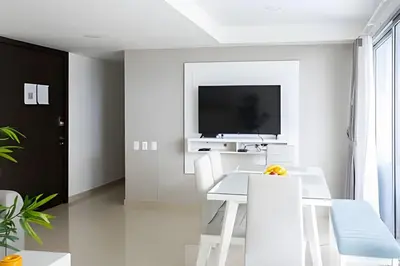 a white dining room with a white table and chairs at Apartamento 2 Dormitorios Morros. Salida playa in Cartagena de Indias