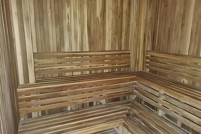 two wooden benches in a room with wooden walls at Apartamento 2 Dormitorios Morros. Salida playa in Cartagena de Indias