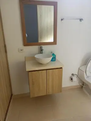 a bathroom with a sink and a mirror at Apartamentos Mi Reserva OK - Fontaine Bleu in Coveñas