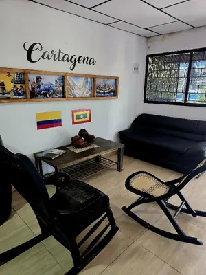 a living room with a couch and a table at Casa ALCATRAZ in Cartagena de Indias