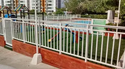 a white fence in front of a swimming pool at Habitación Cangrejo in Barranquilla