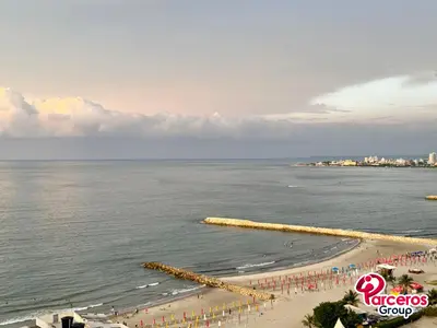 a view of a beach with a group of people at Edificio Las Tres Carabelas Por Parceros Group in Cartagena de Indias