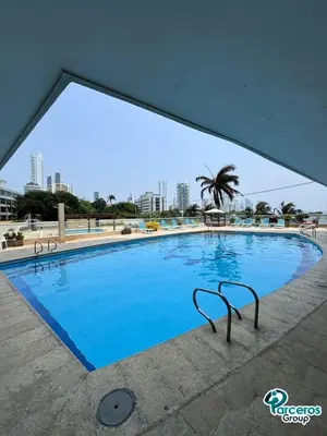 a large swimming pool with blue water at Edificio Las Tres Carabelas Por Parceros Group in Cartagena de Indias