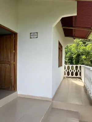 a hallway of a house with a wooden door at Casa Majanicho in Rincón