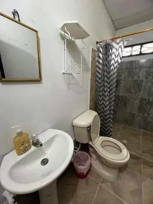 a bathroom with a toilet and a sink at Apartamentos Coveñas TII in Coveñas