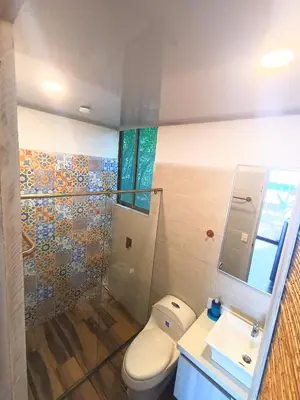 a bathroom with a toilet and a sink at SUITE OCEAN VIEW - Playa in Tolú