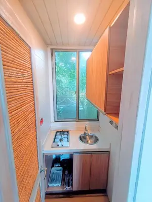 a small kitchen with a sink and a window at SUITE OCEAN VIEW - Playa in Tolú