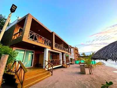 a house on the beach with a balcony at SUITE OCEAN VIEW - Playa in Tolú