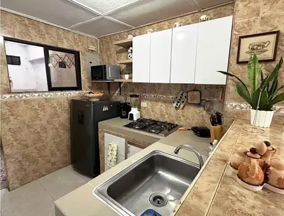 a kitchen with a sink and a stove at Great Location, Apartment Close to the Malecón in Barranquilla